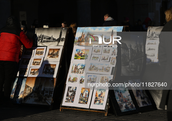 KRAKOW, POLAND - DECEMBER 01:   
A street stand at Krakow's Market Square featuring watercolor paintings of the city's iconic architecture a...