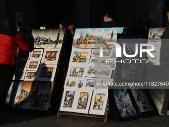 KRAKOW, POLAND - DECEMBER 01:   
A street stand at Krakow's Market Square featuring watercolor paintings of the city's iconic architecture a...