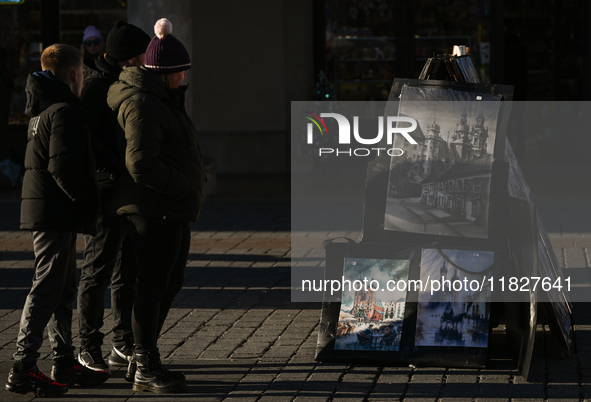 KRAKOW, POLAND - DECEMBER 01:   
A street stand at Krakow's Market Square featuring watercolor paintings of the city's iconic architecture a...