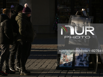 KRAKOW, POLAND - DECEMBER 01:   
A street stand at Krakow's Market Square featuring watercolor paintings of the city's iconic architecture a...