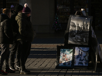 KRAKOW, POLAND - DECEMBER 01:   
A street stand at Krakow's Market Square featuring watercolor paintings of the city's iconic architecture a...