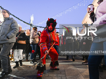 KRAKOW, POLAND - DECEMBER 01:   
A caroler dressed as a devil from a traditional caroling group in the Zielonki Commune, seen at the Christm...