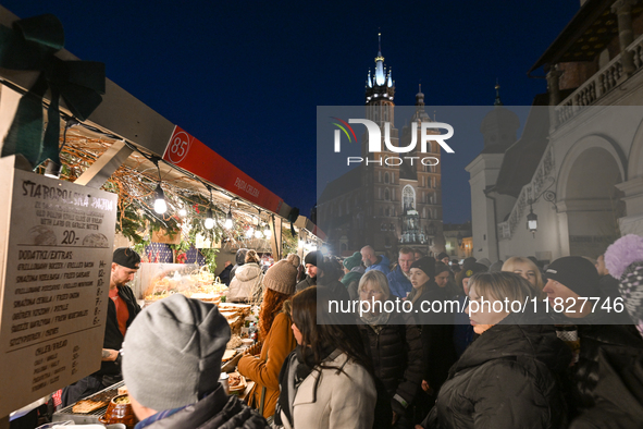 KRAKOW, POLAND - DECEMBER 01:   
A view a crowdy Christmas Market in Krakow's UNESCO-listed Market Square, with festive stalls and holiday d...