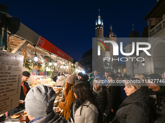 KRAKOW, POLAND - DECEMBER 01:   
A view a crowdy Christmas Market in Krakow's UNESCO-listed Market Square, with festive stalls and holiday d...