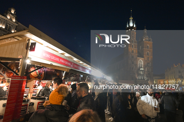 KRAKOW, POLAND - DECEMBER 01:   
A view a crowdy Christmas Market in Krakow's UNESCO-listed Market Square, with festive stalls and holiday d...