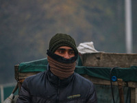 A man looks on amid fog in Srinagar, Jammu and Kashmir, on December 02, 2024. Weather experts warn of heavy snowfall and a harsh winter in J...