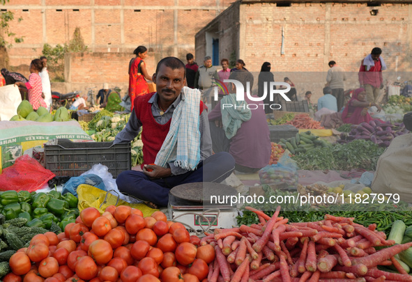 A man stands at his makeshift vegetable shop at a temporary open-air market in Samastipur, Bihar, India, on november 29, 2024.