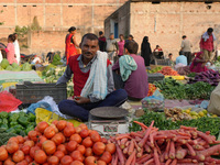 A man stands at his makeshift vegetable shop at a temporary open-air market in Samastipur, Bihar, India, on november 29, 2024.(