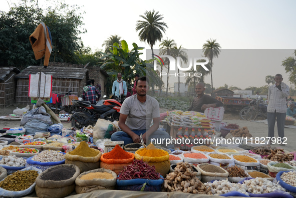 A man sells loose spices at a temporary open-air market in Samastipur, Bihar, India on november 29, 2024.