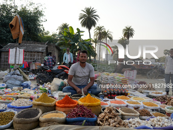 A man sells loose spices at a temporary open-air market in Samastipur, Bihar, India on november 29, 2024.(