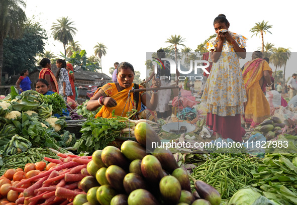 Women sell vegetables at a temporary open-air market in Samastipur, Bihar, India on november 29, 2024.