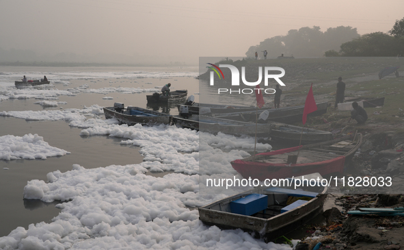 Boats in the Yamuna River are covered in toxic foam in New Delhi, India, on November 7, 2024. 