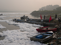 Boats in the Yamuna River are covered in toxic foam in New Delhi, India, on November 7, 2024. (