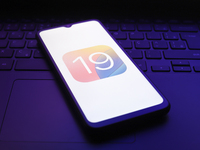 The iOS 19 logo appears on the screen of a smartphone in Reno, United States, on December 2, 2024. (