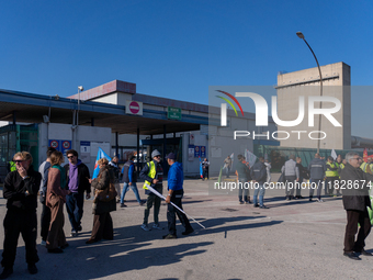 Trasnova workers protest on Monday in front of the gates of the Stellantis plant in Pomigliano D'Arco, Italy, on december 02, 2024. Workers...