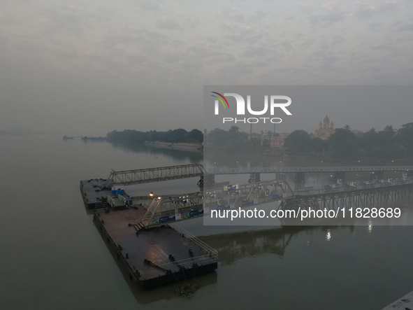 The Ganga River is on a foggy morning amid rising air pollution levels in Kolkata, India, on December 02, 2024. 