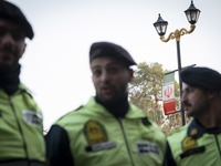 Iranian policemen stand guard outside the Turkish embassy during a protest against Turkish President Recep Tayyip Erdogan and his diplomacy...