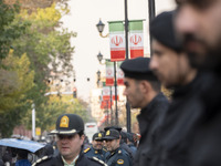 Iranian policemen stand guard outside the Turkish embassy during a protest against Turkish President Recep Tayyip Erdogan and his diplomacy...