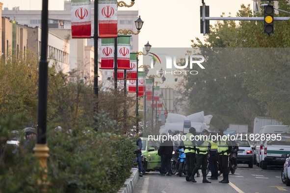 Iranian policemen block a street to the Turkish embassy during a protest against Turkish President Recep Tayyip Erdogan and his diplomacy re...