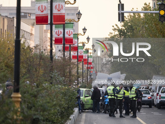 Iranian policemen block a street to the Turkish embassy during a protest against Turkish President Recep Tayyip Erdogan and his diplomacy re...