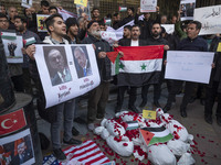 Iranian protesters hold a Syrian flag and an anti-Turkish President placard featuring portraits of the Turkish President and Israeli Prime M...