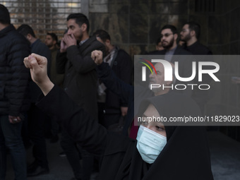 A veiled Iranian protester shouts anti-Turkish President slogans while participating in a protest against Turkish President Recep Tayyip Erd...