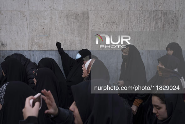 A veiled Iranian protester shouts anti-Turkish President slogans while participating in a protest against Turkish President Recep Tayyip Erd...