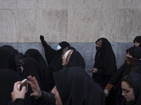 A veiled Iranian protester shouts anti-Turkish President slogans while participating in a protest against Turkish President Recep Tayyip Erd...