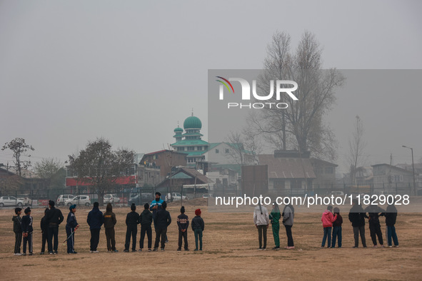 Sikh boys and girls practice hockey in Baramulla, Jammu and Kashmir, India, on December 1, 2024. 