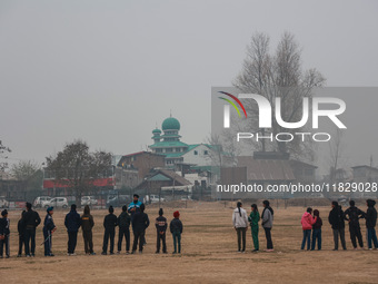 Sikh boys and girls practice hockey in Baramulla, Jammu and Kashmir, India, on December 1, 2024. (