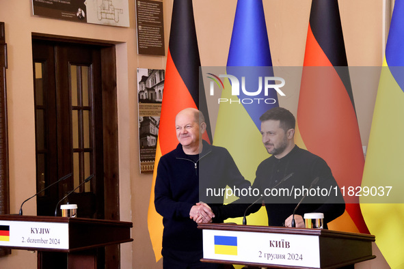 In Kyiv, Ukraine, on December 2, 2024, President of Ukraine Volodymyr Zelenskyy shakes hands with Federal Chancellor of Germany Olaf Scholz...