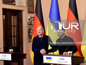 In Kyiv, Ukraine, on December 2, 2024, President of Ukraine Volodymyr Zelenskyy shakes hands with Federal Chancellor of Germany Olaf Scholz...