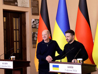 In Kyiv, Ukraine, on December 2, 2024, President of Ukraine Volodymyr Zelenskyy shakes hands with Federal Chancellor of Germany Olaf Scholz...