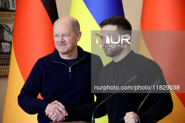 In Kyiv, Ukraine, on December 2, 2024, President of Ukraine Volodymyr Zelenskyy shakes hands with Federal Chancellor of Germany Olaf Scholz...