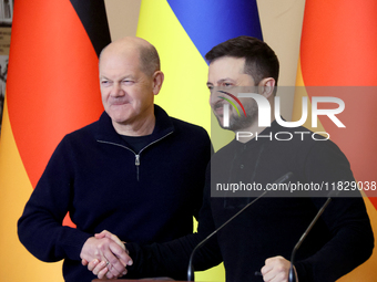 In Kyiv, Ukraine, on December 2, 2024, President of Ukraine Volodymyr Zelenskyy shakes hands with Federal Chancellor of Germany Olaf Scholz...