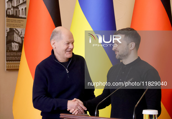 In Kyiv, Ukraine, on December 2, 2024, President of Ukraine Volodymyr Zelenskyy shakes hands with Federal Chancellor of Germany Olaf Scholz...