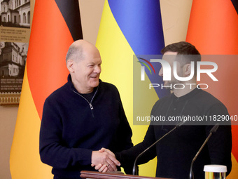 In Kyiv, Ukraine, on December 2, 2024, President of Ukraine Volodymyr Zelenskyy shakes hands with Federal Chancellor of Germany Olaf Scholz...