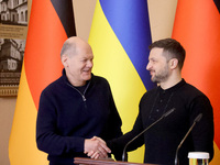 In Kyiv, Ukraine, on December 2, 2024, President of Ukraine Volodymyr Zelenskyy shakes hands with Federal Chancellor of Germany Olaf Scholz...