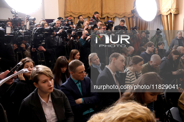 Reporters cover a joint briefing of the President of Ukraine, Volodymyr Zelenskyy, and the Federal Chancellor of Germany, Olaf Scholz, in Ky...