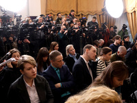 Reporters cover a joint briefing of the President of Ukraine, Volodymyr Zelenskyy, and the Federal Chancellor of Germany, Olaf Scholz, in Ky...