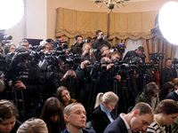 Reporters cover a joint briefing of the President of Ukraine, Volodymyr Zelenskyy, and the Federal Chancellor of Germany, Olaf Scholz, in Ky...