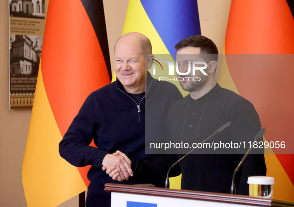 In Kyiv, Ukraine, on December 2, 2024, President of Ukraine Volodymyr Zelenskyy shakes hands with Federal Chancellor of Germany Olaf Scholz...