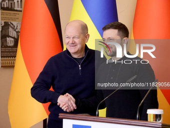 In Kyiv, Ukraine, on December 2, 2024, President of Ukraine Volodymyr Zelenskyy shakes hands with Federal Chancellor of Germany Olaf Scholz...