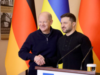 In Kyiv, Ukraine, on December 2, 2024, President of Ukraine Volodymyr Zelenskyy shakes hands with Federal Chancellor of Germany Olaf Scholz...