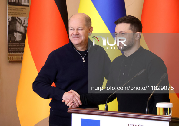 In Kyiv, Ukraine, on December 2, 2024, President of Ukraine Volodymyr Zelenskyy shakes hands with Federal Chancellor of Germany Olaf Scholz...