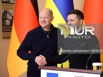 In Kyiv, Ukraine, on December 2, 2024, President of Ukraine Volodymyr Zelenskyy shakes hands with Federal Chancellor of Germany Olaf Scholz...