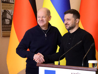 In Kyiv, Ukraine, on December 2, 2024, President of Ukraine Volodymyr Zelenskyy shakes hands with Federal Chancellor of Germany Olaf Scholz...