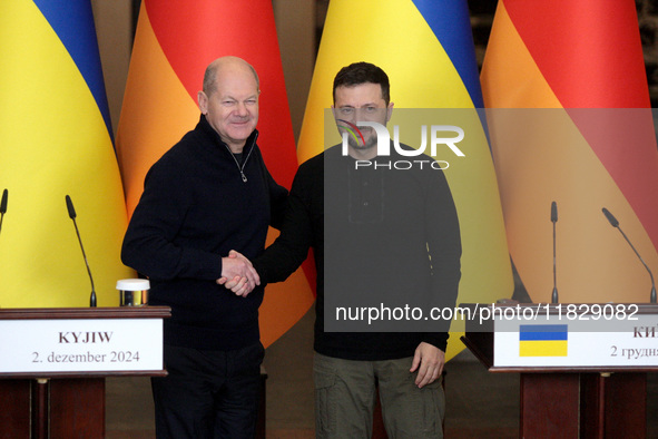 In Kyiv, Ukraine, on December 2, 2024, President of Ukraine Volodymyr Zelenskyy shakes hands with Federal Chancellor of Germany Olaf Scholz...