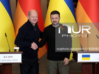 In Kyiv, Ukraine, on December 2, 2024, President of Ukraine Volodymyr Zelenskyy shakes hands with Federal Chancellor of Germany Olaf Scholz...