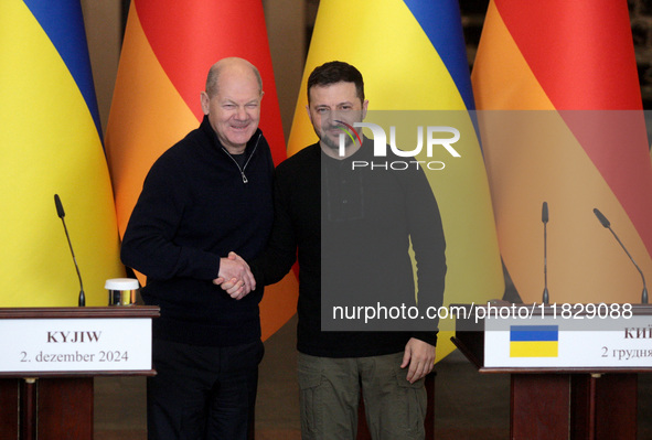 In Kyiv, Ukraine, on December 2, 2024, President of Ukraine Volodymyr Zelenskyy shakes hands with Federal Chancellor of Germany Olaf Scholz...